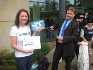 R Eric Swanepoel cuts up RBS card outside RBS AGM