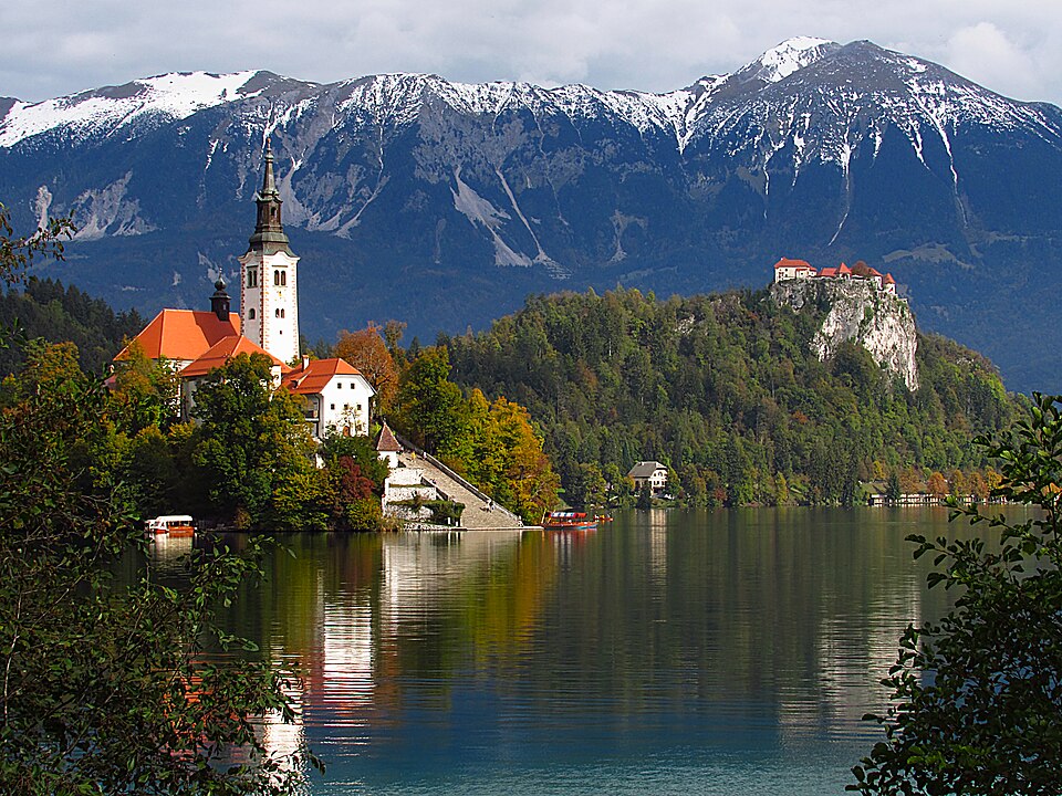 Church of the Assumption of the Blessed Mary on Bled Island and Bled Castle in Slovenia. Photo: Konstantin Burkut. This file is licensed under the Creative Commons Attribution-Share Alike 4.0 International license.
