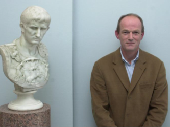 Mark Tyndall, co-founder of Artemis, alongside a bust of Caesar Augustus
