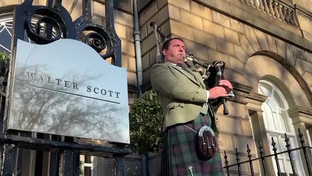 Bagpiper plays outside Walter Scott & Partners office on Edinburgh's Charlotte Square, as the firm is sold to Pittsburgh based Mellon Financial