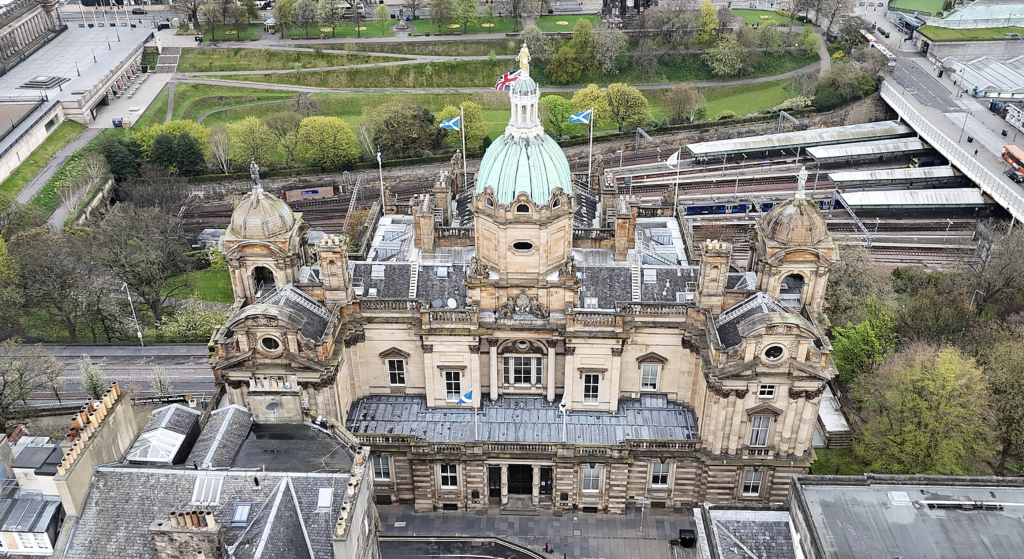 Bank of Scotland's former HQ on the Mound. The site was acquired by Bank of Scotland in 1800. The original building, designed by Robert Reid and Richard Crichton in 1801 and built by William Sibbald Jr in 1802-6, was not widely admired. First Thomas Hamilton and then Peddie & Kinnear provided recasting schemes. In 1863 David Bryce was appointed; his design was executed by William Beattie & Son in 1864-70 with sculpture by John Rhind. To the south, facing Bank Street (the elevation prominent in the photo), much of Reid and Crichton's front survives. In 1878, the screen wall was replaced by Peddie and Kinnear.

Photo: Theo Ho (瑞丽江的河水). File licensed under the Creative Commons Attribution-Share Alike 4.0 International license.